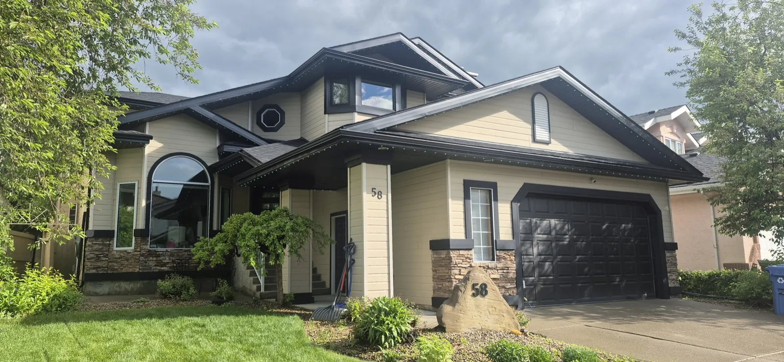 Calgary home in daylight with Diamond Bright permanent LED channel colour-matched to the trim — virtually invisible by day